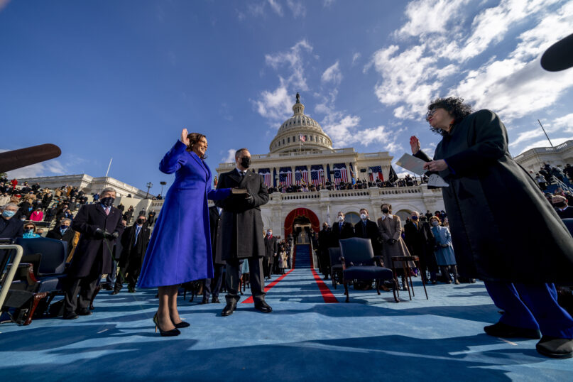 Kamala Harris is sworn in as vice president by Supreme Court Justice Sonia Sotomayor as her husband, Doug Emhoff, holds the Bible during the 59th Presidential Inauguration at the U.S. Capitol in Washington, Jan. 20, 2021. (AP Photo/Andrew Harnik, Pool)