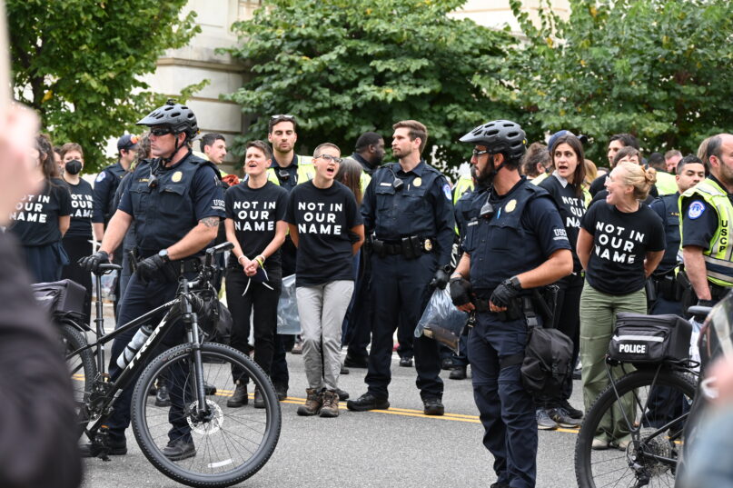 Capitol Police arrest demonstrators urging the U.S. government to advocate for a ceasefire i Gaza outside the Cannon building on Capitol Hill on Wednesday, Oct 18. RNS photo by Jack Jenkins.