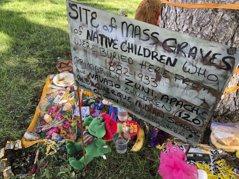 A makeshift memorial for the dozens of Indigenous children who died more than a century ago while attending a boarding school that was once located nearby is displayed under a tree July 1, 2021, in Albuquerque, N.M. (AP Photo/Susan Montoya Bryan, File)