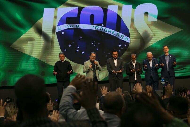 Pastor Silas Malafaia, second from left, prays alongside President Jair Bolsonaro, far left, at the Assembly of God Victory in Christ Church in Rio de Janeiro. (AP Photo/Bruna Prado)