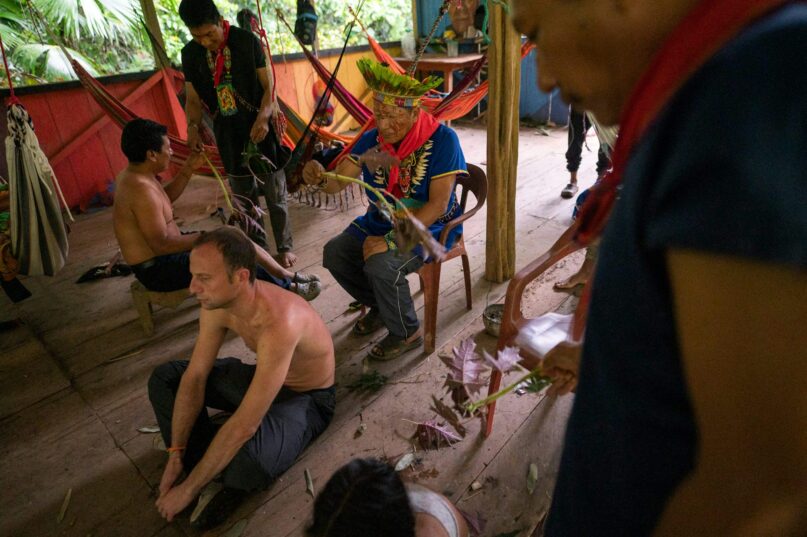 A healer conducts an ayahuasca drinking ceremony in Avie village, in Ecuador, on Jan.14, 2023. Pedro Pardo / AFP via Getty images