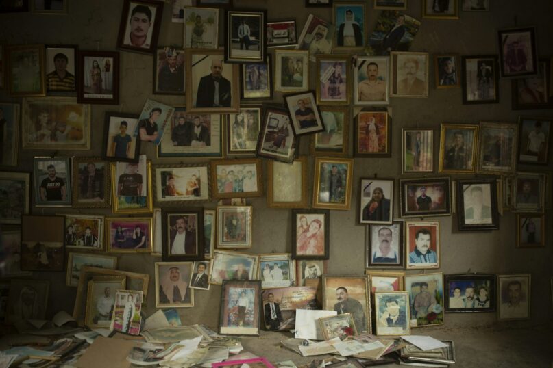 Pictures of Yezidis slain in 2014 by Islamic State group militants, found in a small room at the Lalish shrine in northern Iraq. AP Photo/Maya Alleruzzo