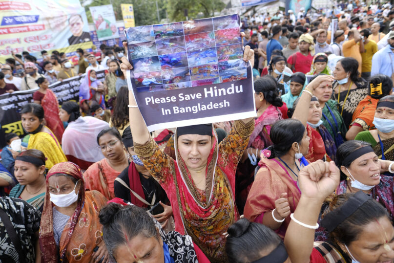 Hundreds of Hindus protesting against attacks on temples and the killing of two Hindu devotees in another district shout slogans in Dhaka, Bangladesh, Monday, Oct.18, 2021. A viral social media image perceived as insulting to the country's Muslim majority last week triggered protests and incidents of vandalism at Hindu temples across Bangladesh. About 9% of Bangladesh’s 160 million people are Hindus. (AP Photo/Mahmud Hossain Opu)