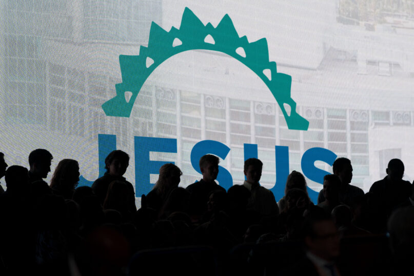 Choir members are silhouetted as they get ready for a worship service at the Southern Baptist Convention’s annual meeting in Anaheim, California, June 14, 2022. (AP Photo/Jae C. Hong)