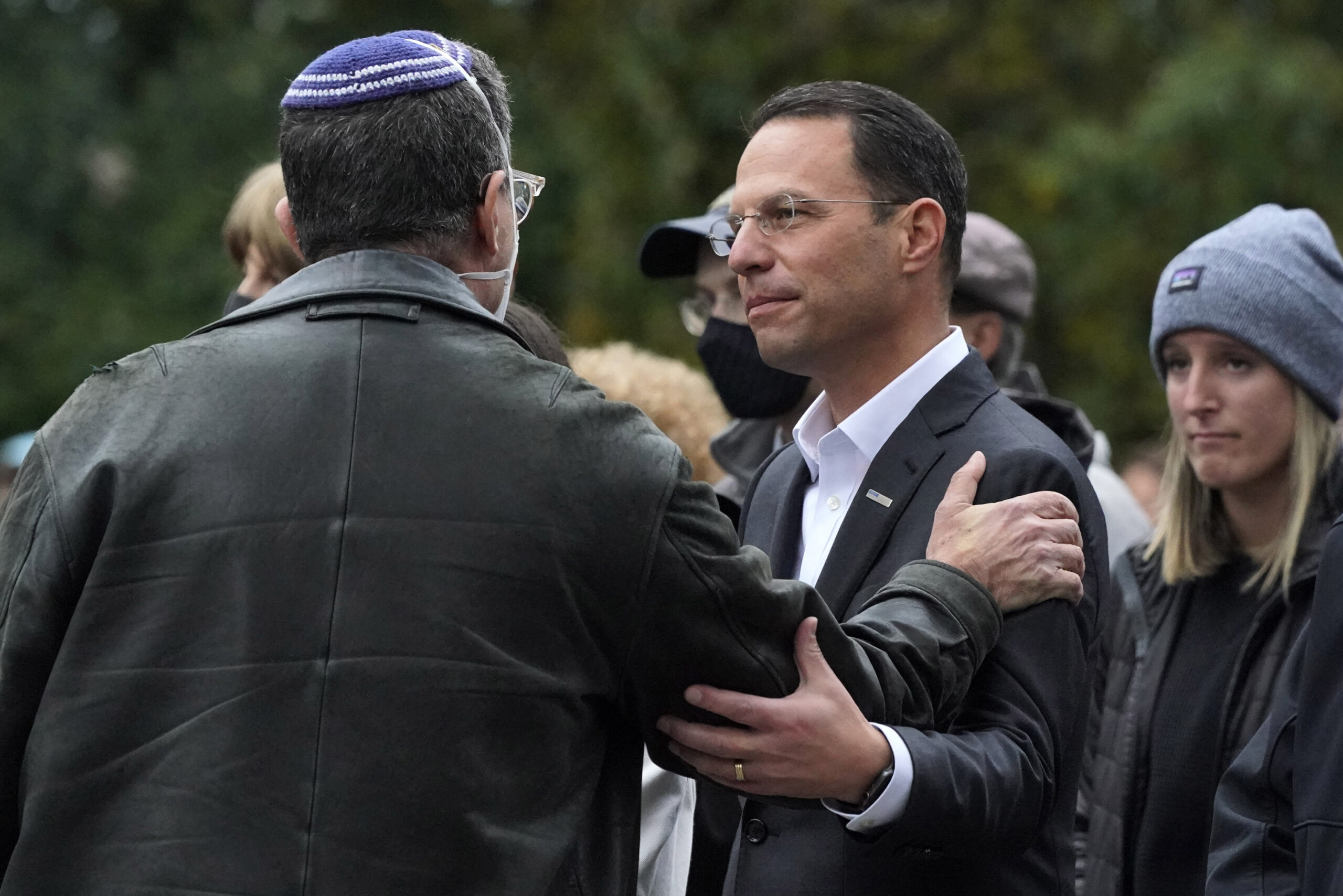 FILE - Then Pennsylvania Attorney General Josh Shapiro, center, attends a Commemoration Ceremony in Schenley Park, in Pittsburgh's Squirrel Hill neighborhood, on Wednesday, Oct. 27, 2021, three years after a gunman killed 11 worshippers at the Tree of Life Synagogue. Shapiro will be taking office as Pennsylvania's next governor in January 2023 after running a campaign in which he spoke early and often about his Jewish religious heritage. (AP Photo/Gene J. Puskar, File)