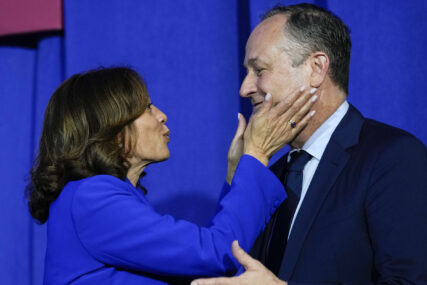 Vice President Kamala Harris leans in to kiss her husband Doug Emhoff after she spoke during an event in Washington, Friday, June 23, 2023. (AP Photo/Susan Walsh)