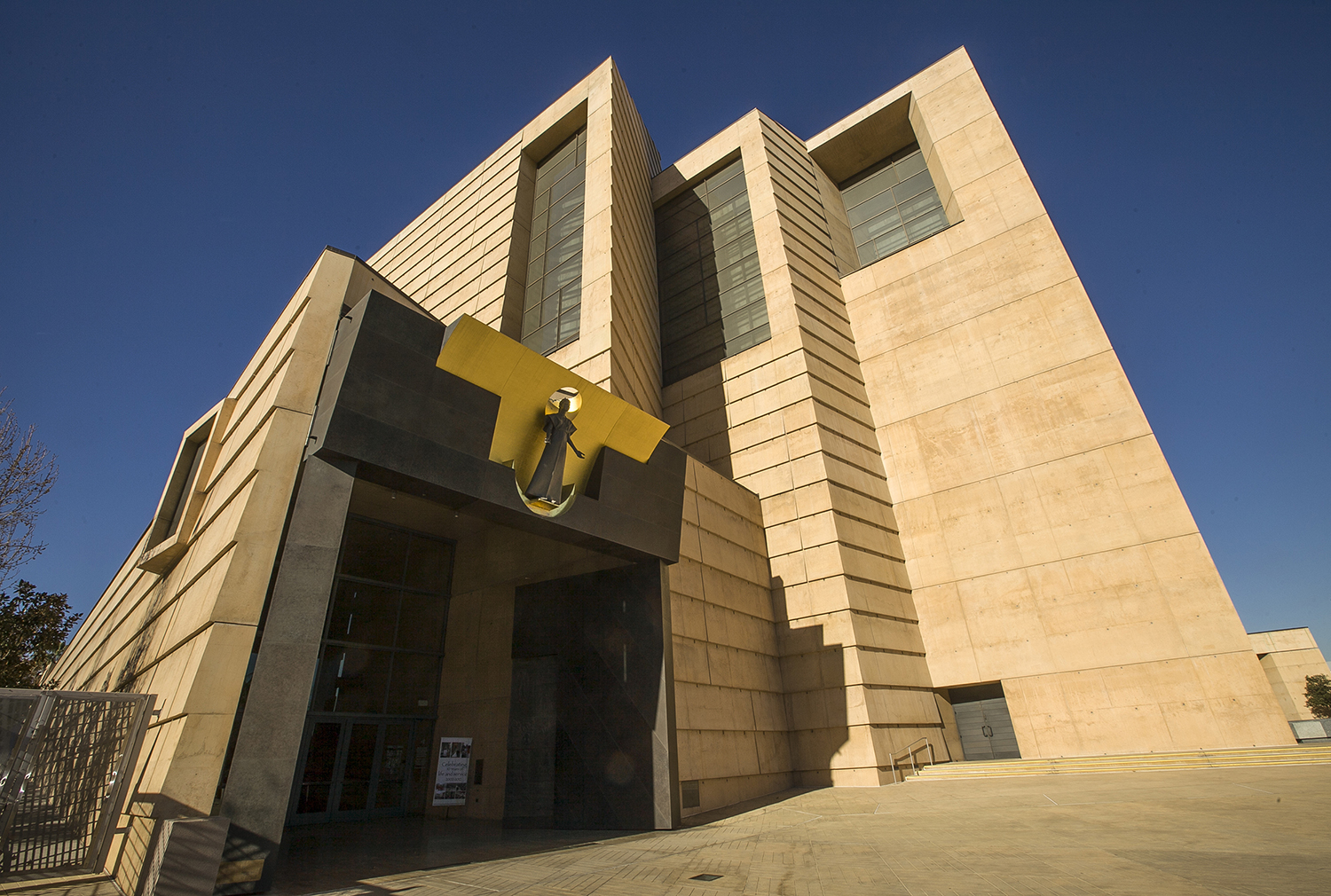 FILE - This Jan. 21, 2013 file photo shows the entrance to the Cathedral of Our Lady of the Angels, the headquarters for the Roman Catholic Archdiocese of Los Angeles. California is one of several states that have repeatedly extended the window for people to sue institutions over long-ago abuse, leading to thousands of new cases. (AP Photo/Damian Dovarganes, File)