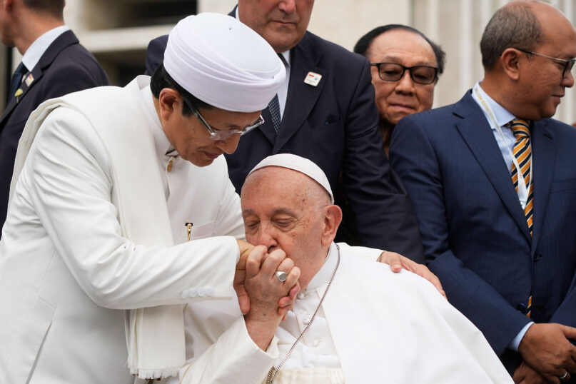 Pope Francis bids farewell to Grand Imam Nasaruddin Umar, left, as he leaves after signing the “Joint Declaration of Istiqlal 2024” at the Istiqlal Mosque in Jakarta, Sept. 5, 2024. The pope urged Indonesia to live up to its promise of “harmony in diversity” and fight religious intolerance on Wednesday, as he set a rigorous pace for an 11-day, four-nation trip through tropical Southeast Asia and Oceania. (AP Photo/Gregorio Borgia)