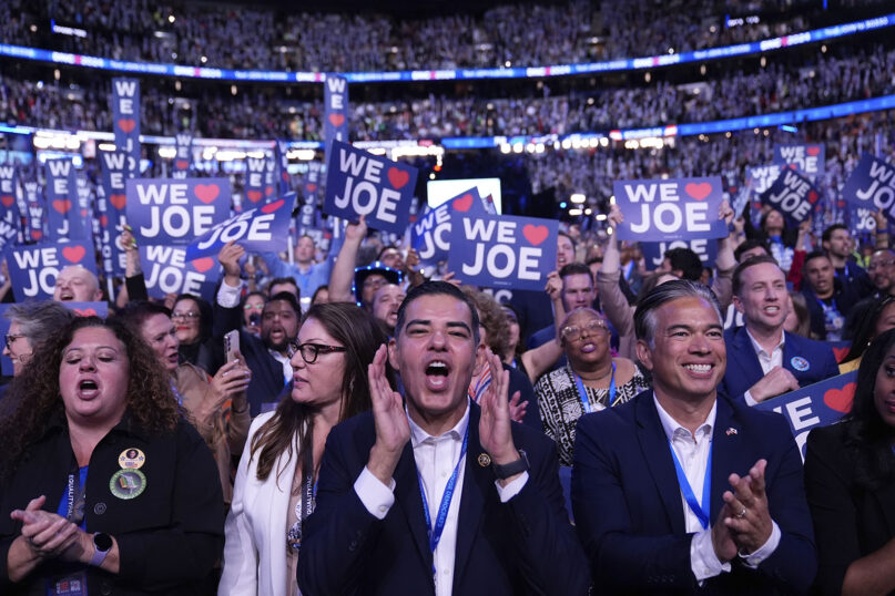 Delegates cheer as President Joe Biden speaks during the Democratic National Convention, Aug. 19, 2024, in Chicago. (AP Photo/Paul Sancya)