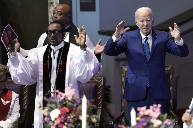 President Joe Biden joins senior pastor Bishop J. Louis Felton during a church service at Mount Airy Church of God in Christ, Sunday, July 7, 2024, in Philadelphia. (AP Photo/Manuel Balce Ceneta)