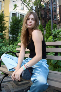 Amelia, an artist and Buddhist influencer who goes by “sotce”, poses in a garden in Manhattan, New York, on June 20, 2024. (Photo by Fiona Murphy.)