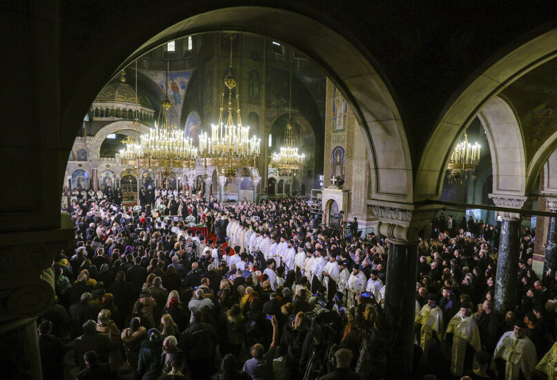 Hundreds of people, officials and Orthodox Church clergy attend the solemn holy liturgy and funeral service for Bulgarian Orthodox Patriarch Neophyte at the Alexander Nevsky Cathedral in Sofia, Bulgaria, Saturday, March 16, 2024. Bulgarians lined the streets of Sofia to bid farewell to the late Orthodox Patriarch Neophyte. Neophyte, who became patriarch in 2013, was the first elected head of the Bulgarian church after the fall of communism in 1989. (AP Photo/Valentina Petrova)