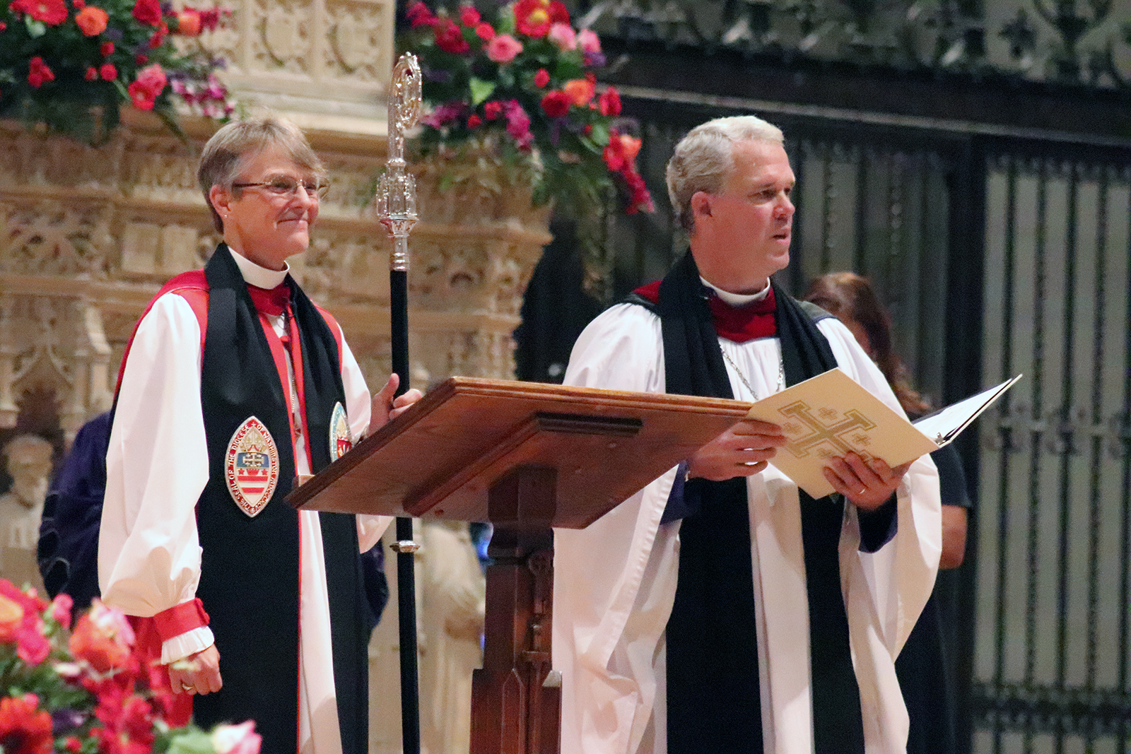 The Rt. Rev. Mariann Edgar Budde, left, and the Very Rev. Randy Hollerith officiate an unveiling and dedication ceremony at the Washington National Cathedral for new stained-glass windows, Saturday, Sept. 23, 2023. RNS photo by Adelle M. Banks