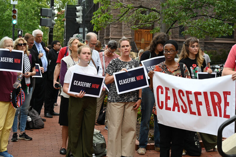 Interfaith demonstrators gather outside the offices of the Friends Committee on National Legislation, a Quaker group, July 24, 2024, in Washington, D.C. (RNS photo/Jack Jenkins)