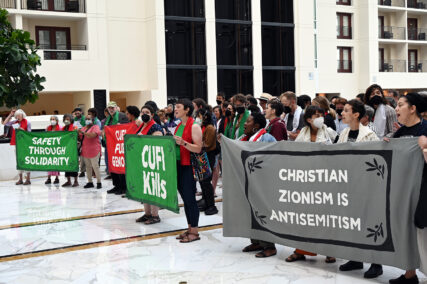 An interfaith group of pro-Palestinian protesters interrupts the Christians United for Israel summit inside the Gaylord National Resort and Convention Center, Monday, July 29, 2024, in National Harbor, Maryland. (RNS photo/Jack Jenkins)