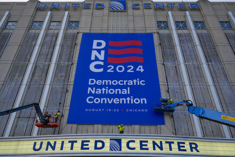 Signage is hung Aug. 14, 2024, on the exterior of the United Center in preparation for next week's Democratic National Convention in Chicago.(AP Photo/Pablo Martinez Monsivais)