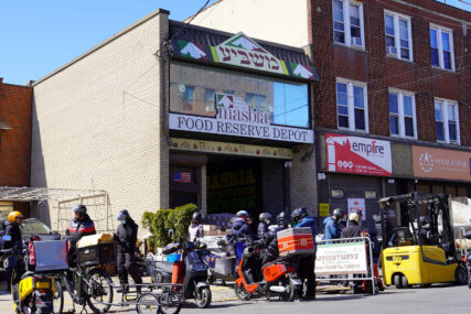 Lots of DoorDash delivery personnel await their next deliveries outside of the Masbia Food Reserve Depot in Brooklyn, New York, before Passover 2023. (Photo courtesy Masbia)