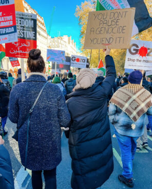 A sign reads "You Don't Pause A Genocide, You End It!" during a pro-Palestinian march in London on Nov. 25, 2023. (Photo courtesy Ellie Quinn)