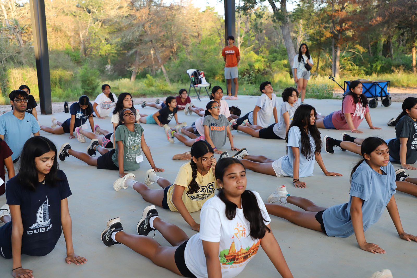 Senior campers practice surya namaskar, or sun salutations, during the Hindu Heritage Youth Camp at the Texas Hindu Campsite in Houston. (Photo courtesy Hindu Heritage Youth Camp)