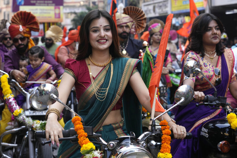 People dressed in traditional attire participate in a procession to mark Gudi Padwa, or the Marathi New Year, in Mumbai, India, Tuesday, April 9, 2024.(AP Photo/Rajanish Kakade)