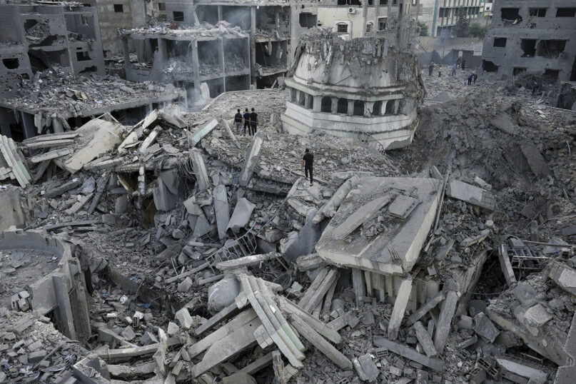 Palestinians inspect the rubble of the destroyed Yassin Mosque after it was hit by an Israeli airstrike at Shati refugee camp in Gaza City, Oct. 9, 2023. (AP Photo/Adel Hana)