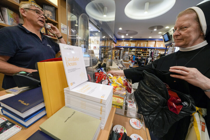 Copies of Pope Francis’ latest letter on the environment, “Laudate Deum,” are on sale in a bookshop in Rome, Oct. 4, 2023. (AP Photo/Andrew Medichini)