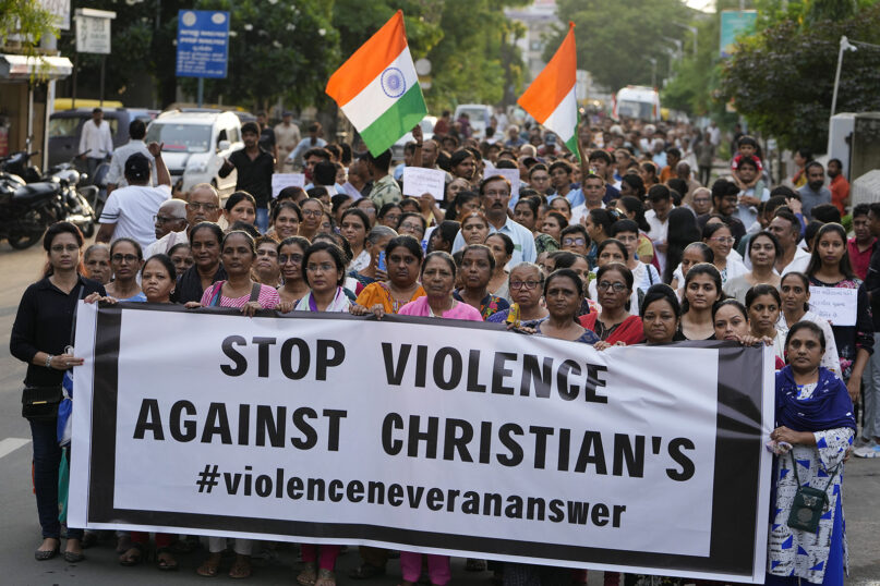 Demonstrators hold a banner during a rally in solidarity with the people of northeastern Manipur state, in Ahmedabad, India, July 23, 2023. (AP Photo/Ajit Solanki)