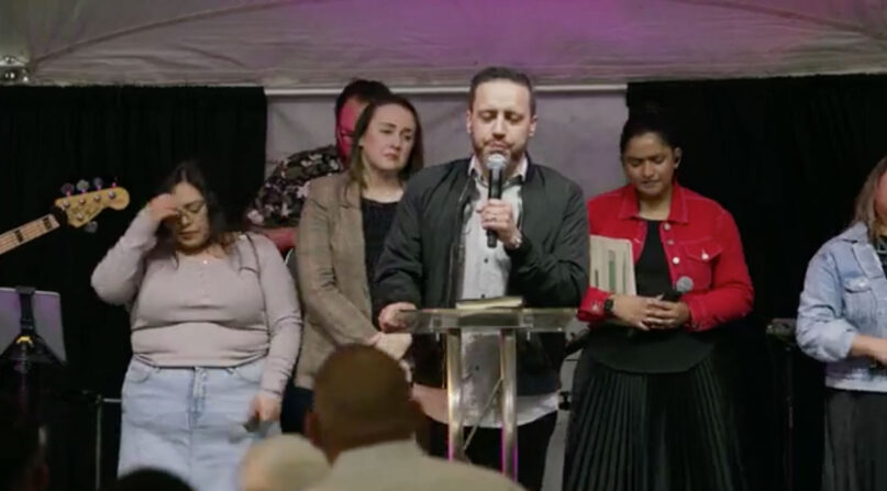 Pastor Tony Suarez leads a tent revival in the Texas border town of McAllen. (Video screen grab)