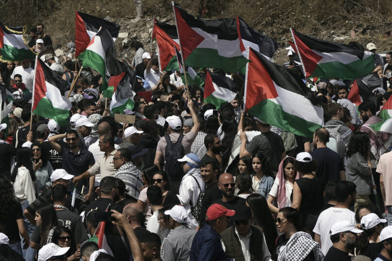 People take part in a march May 14, 2024, in support of the Palestinian people ahead of Nakba Day at the Al Kasayir village, in Haifa. Palestinians on May 15, 2024, marked the 76th year of their mass expulsion from what is now Israel. They refer to it as the Nakba, Arabic for “catastrophe.” (AP Photo/Mahmoud illean)