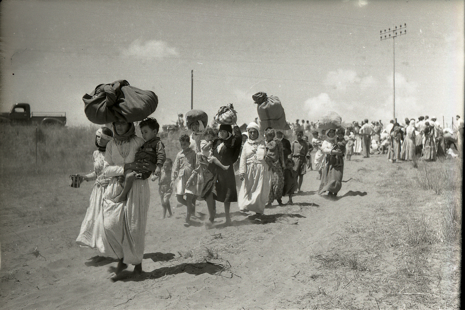 The 1948 expulsion of Palestinian women and children from Tantura to Furaydis. (Photo by Benno Rothenberg/Meitar Collection/National Library of Israel/The Pritzker Family National Photography Collection/CC-BY 4.0)