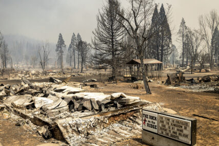 A church marquee stands among buildings destroyed by the Dixie Fire in Greenville on Thursday, Aug. 5, 2021, in Plumas County, Calif. (AP Photo/Noah Berger)