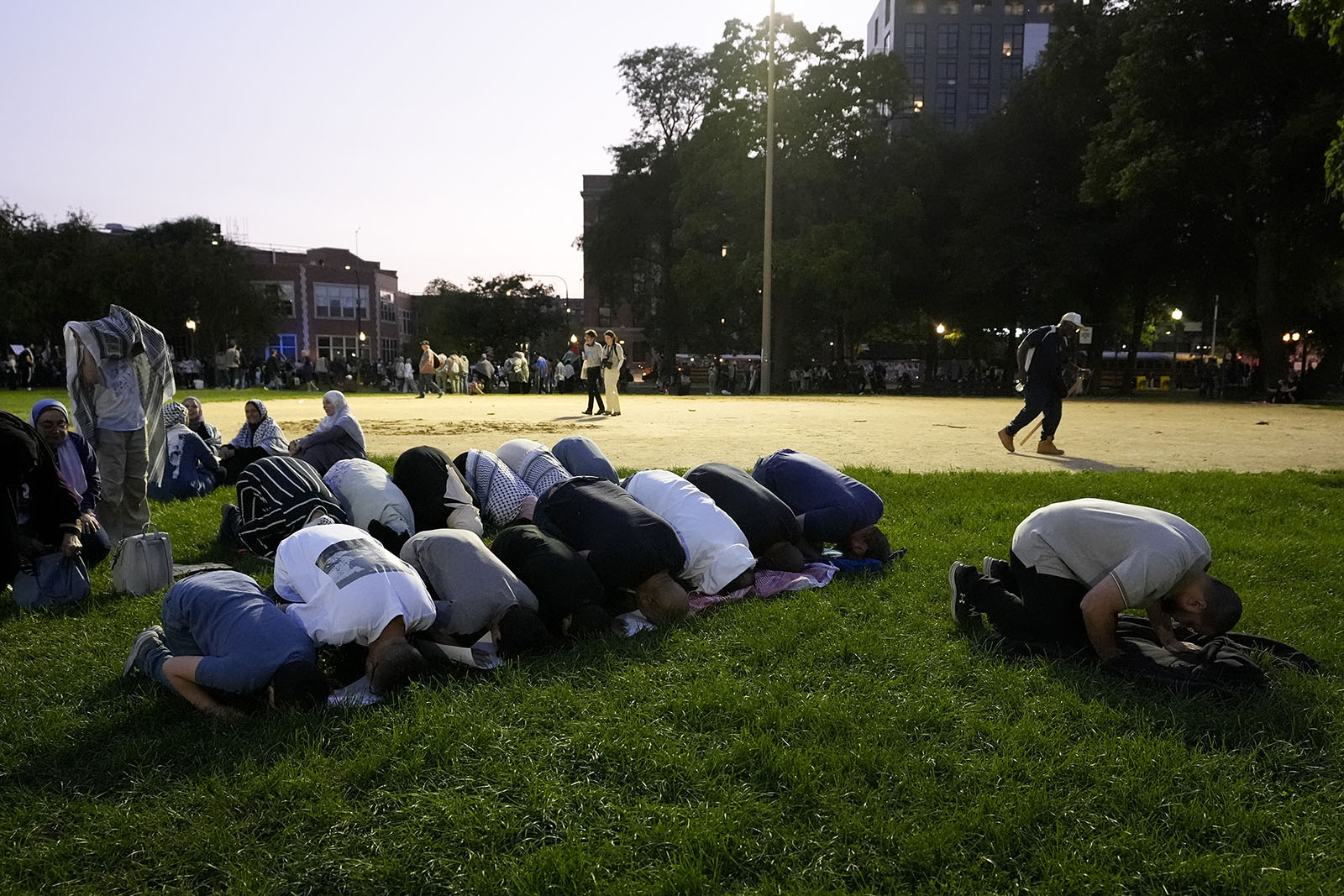 Demonstrators pray after a march outside the Democratic National Convention, Wednesday, Aug. 21, 2024, in Chicago. (AP Photo/Alex Brandon)