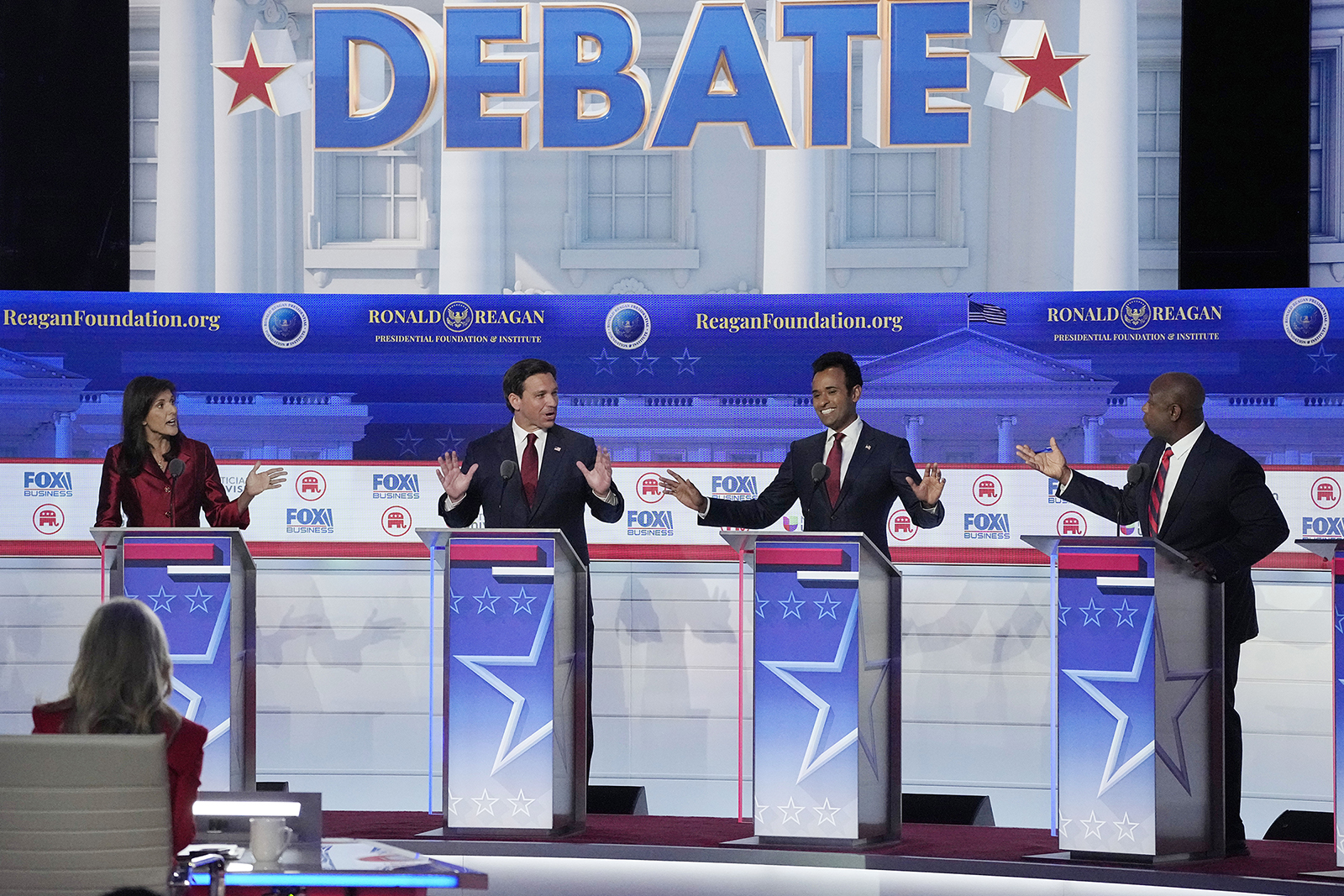 From left to right, former U.N. Ambassador Nikki Haley, Florida Gov. Ron DeSantis, businessman Vivek Ramaswamy and Sen. Tim Scott, R-S.C., argue a point during a Republican presidential primary debate hosted by FOX Business Network and Univision, Wednesday, Sept. 27, 2023, at the Ronald Reagan Presidential Library in Simi Valley, Calif. (AP Photo/Mark J. Terrill)