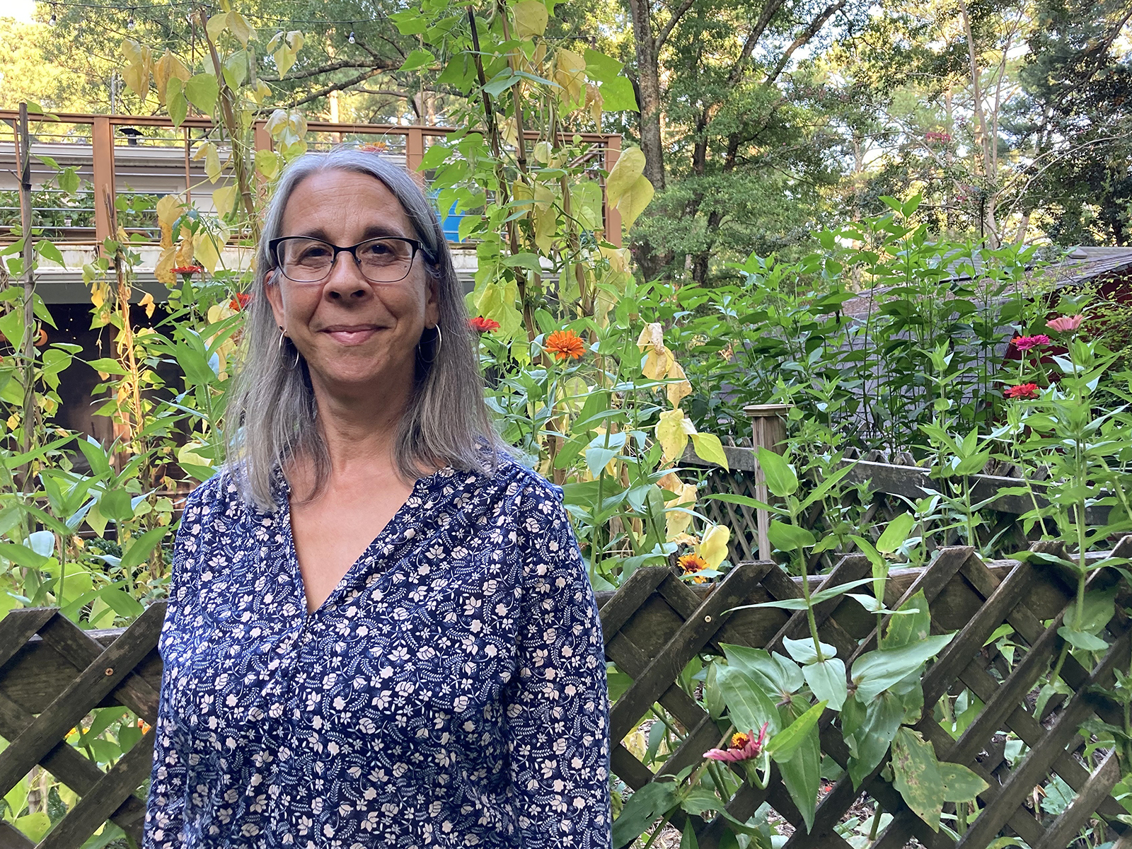 Beth Brockman, a spiritual director and a Presbyterian who lives in Durham, North Carolina, in her backyard on Aug. 22, 2024. (RNS photo/Yonat Shimron)