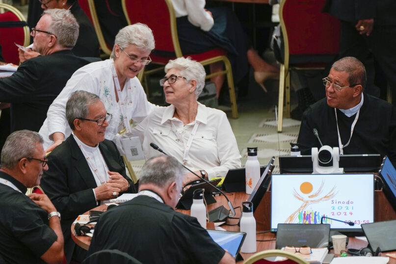 Participants of the 16th General Assembly of the Synod of Bishops attend a daily session with Pope Francis, not shown, in the Paul VI Hall at the Vatican, Oct. 16, 2023. (AP Photo/Domenico Stinellis)