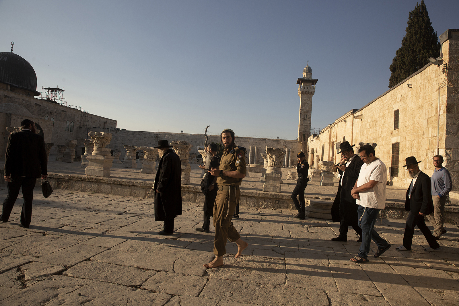 Religious Jews arrive to pray at the Temple Mount, known to Muslims as the Noble Sanctuary, in the Old City of Jerusalem, Aug. 2, 2021. Jewish prayers at Jerusalem’s most sensitive holy site, known to Jews as the Temple Mount and to Muslims as the Noble Sanctuary, were once unthinkable. But they have quietly become the norm in recent years, defying long-standing convention, straining a delicate status quo and raising fears that they could trigger a new wave of violence in the Middle East. (AP Photo/Maya Alleruzzo)