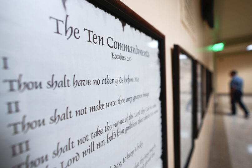 A copy of the Ten Commandments is posted along with other historical documents in a hallway at the Georgia Capitol, June 20, 2024, in Atlanta. Louisiana has become the first state in the country to require the Ten Commandments be displayed in all public schools. (AP Photo/John Bazemore)