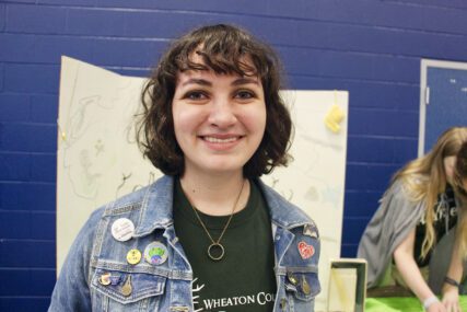 Elizabeth Church, president of the Wheaton College Tolkien Society, was one of several students helping to run a booth about the club at the school's Ministry and Club Fair. RNS Photo by Emily Miller