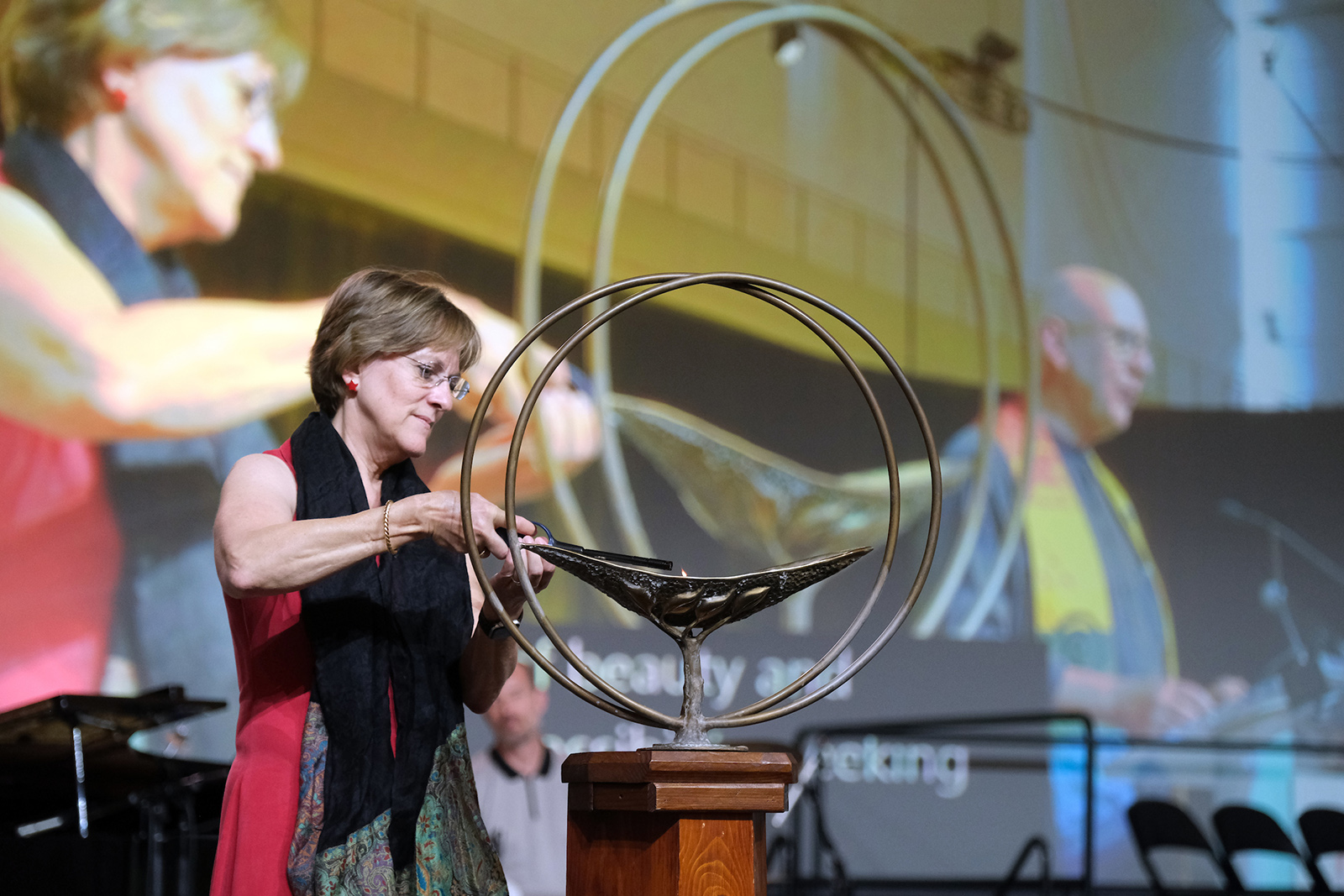 The Rev. Kate Walker lights the chalice during the General Assembly Opening Celebration on Wednesday, June 21, 2023, in Pittsburgh, Pennsylvania. Photo © 2023 Nancy Pierce/UUA