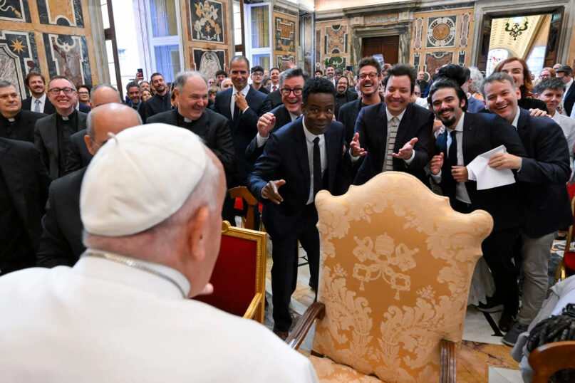 Pope Francis looks at American comedians Stephen Colbert, Chris Rock and Jimmy Fallon, among others, as he meets with more than 100 comedians from around the world at the Vatican on June 14, 2024, encouraging them to cheer people up and help people see reality with all its contradictions. (Photo by Simone Risoluti/Vatican Media)