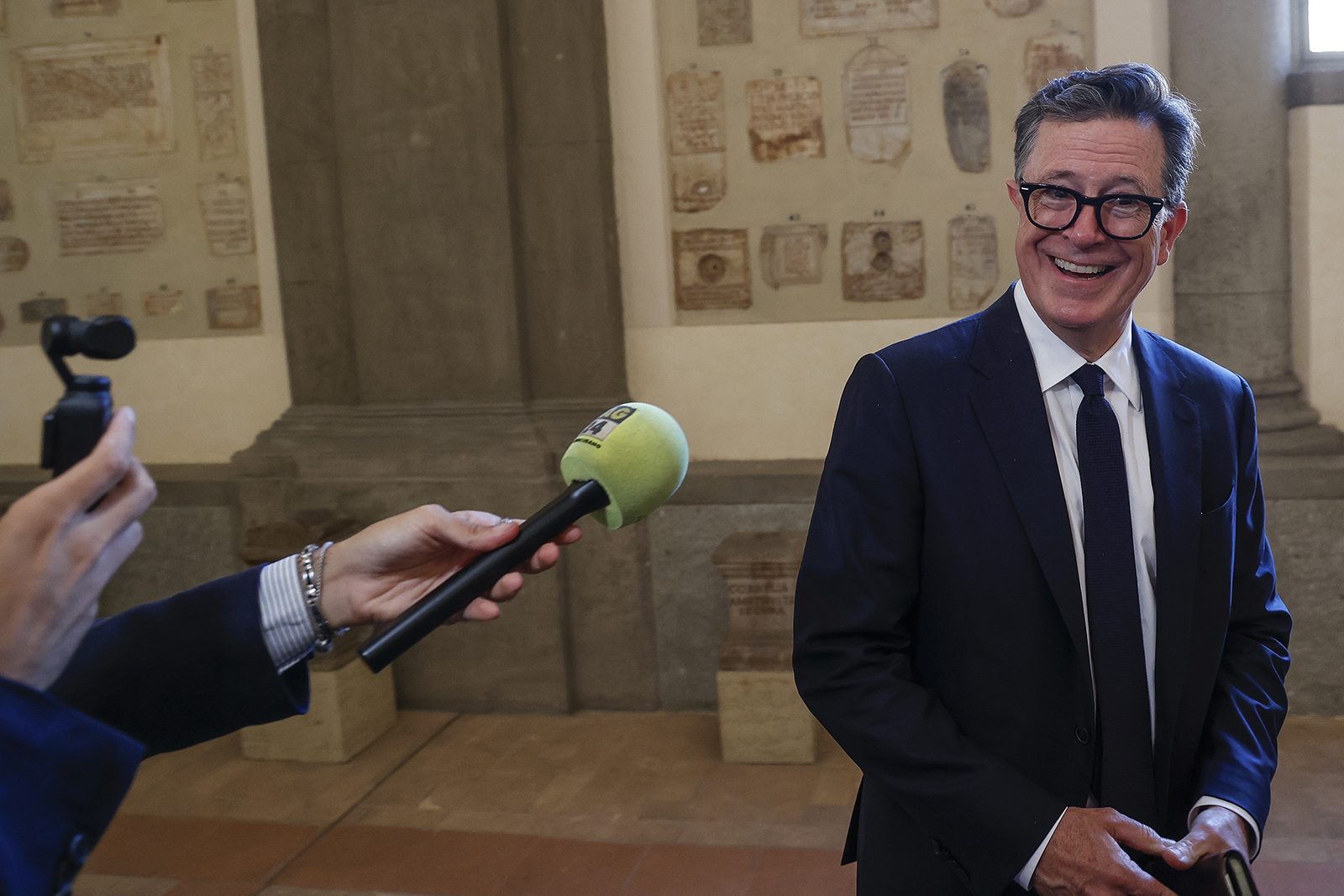 Stephen Colbert is interviewed after an audience with Pope Francis in Clementine Hall at the Vatican, Friday, June 14, 2024. (AP Photo/Riccardo De Luca)