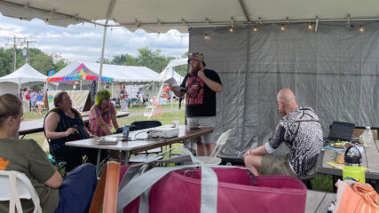 Kaleb Graves, standing center, leads a workshop at Wild Goose Festival, Friday, July 12, 2024, in Union Grove, North Carolina. (RNS photo/Ellie Davis)