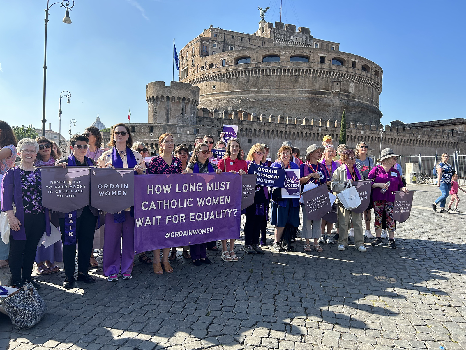 Dozens of women march to the Vatican, Oct. 6, 2023, calling for female ordination. (RNS photo/Tom Reese)