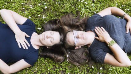 Marci Becker, left, and Summer Cushman co-lead a Yoga Church. (Video screen grab)