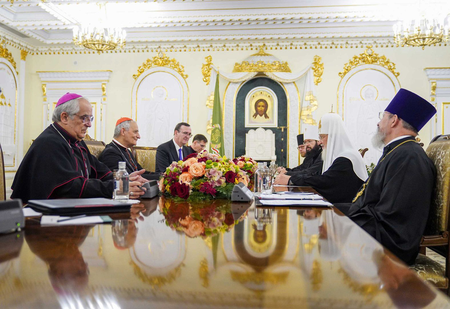 Russian Orthodox clergy and Patriarch Kirill, right side of table, meet with Cardinal Matteo Zuppi and Roman Cathoic delegates at the Patriarchal Residence in Danilov Monastery, in Moscow, Russia, Thursday, June 29, 2023. Photo by Moscow Patriarchate