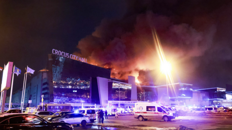 Smoke rises over the Crocus City Hall in the Moscow region where terrorists opened fire. Credit: Vladimir Gerdo/TASS